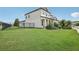 House exterior showcasing a well-maintained lawn and a fenced backyard at 30425 Pecan Valley Loop, Wesley Chapel, FL 33543