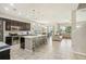 Open concept kitchen with island, stainless steel appliances, and ample counter space at 30425 Pecan Valley Loop, Wesley Chapel, FL 33543