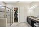 Elegant Primary bathroom with double vanity and walk-in shower at 30425 Pecan Valley Loop, Wesley Chapel, FL 33543