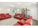 Spacious game room with comfortable seating and a collection display at 30425 Pecan Valley Loop, Wesley Chapel, FL 33543