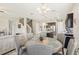 Casual dining area with a round table and chairs, and views into the kitchen and Gathering room at 30425 Pecan Valley Loop, Wesley Chapel, FL 33543