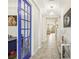 Bright and spacious entryway with tile flooring and a view of the living room at 30425 Pecan Valley Loop, Wesley Chapel, FL 33543