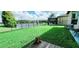 Backyard with pond view and a wooden deck at 30425 Pecan Valley Loop, Wesley Chapel, FL 33543