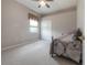 Cozy bedroom with carpeted floor and built-in closet at 13049 Thoroughbred Dr, Dade City, FL 33525