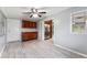 Bright dining room with access to kitchen and wood cabinets at 2904 Lewis Rd, Dover, FL 33527