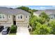 Aerial view of townhome with driveway and neighboring houses at 11638 Cambium Crown Dr, Riverview, FL 33569