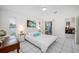 Bright bedroom with garden views and a ceiling fan at 11639 Sunshine Pond Rd, Tampa, FL 33635