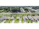 Aerial view of houses with solar panels and community at 7864 Broad Pointe Dr, Zephyrhills, FL 33540