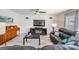 Comfortable living room with sectional sofa and fireplace at 7864 Broad Pointe Dr, Zephyrhills, FL 33540