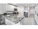 Modern kitchen with stainless steel appliances and granite countertops at 7864 Broad Pointe Dr, Zephyrhills, FL 33540