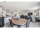 Open dining area with a wooden table and kitchen views at 7864 Broad Pointe Dr, Zephyrhills, FL 33540