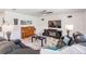 Living room with leather sofas, a piano and a TV at 7864 Broad Pointe Dr, Zephyrhills, FL 33540
