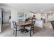 Dining room with a wooden table and adjacent kitchen at 7864 Broad Pointe Dr, Zephyrhills, FL 33540