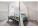 Bedroom with canopy bed and teal bedding at 7864 Broad Pointe Dr, Zephyrhills, FL 33540