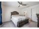 Bright bedroom with ceiling fan and en-suite bathroom at 7864 Broad Pointe Dr, Zephyrhills, FL 33540