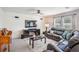 Relaxing living room featuring comfortable seating and a modern fireplace at 7864 Broad Pointe Dr, Zephyrhills, FL 33540