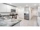 Modern kitchen with stainless steel appliances and granite countertops at 7864 Broad Pointe Dr, Zephyrhills, FL 33540
