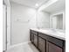 Bathroom with double vanity and dark brown cabinets at 11923 Downy Birch Dr, Riverview, FL 33569