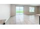 Bright dining area with sliding glass doors leading to backyard at 11923 Downy Birch Dr, Riverview, FL 33569