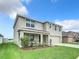 Two-story house with neutral color scheme and well-maintained landscaping at 11923 Downy Birch Dr, Riverview, FL 33569