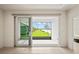 Private patio with lake views, accessible through sliding doors at 4906 Avila Lakes Dr, Wimauma, FL 33598