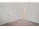 Simple bedroom with carpeted floor and neutral walls at 4906 Avila Lakes Dr, Wimauma, FL 33598