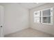 Spacious bedroom with tile floors and large window at 4906 Avila Lakes Dr, Wimauma, FL 33598