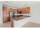 Modern kitchen with stainless steel appliances and granite countertops at 4906 Avila Lakes Dr, Wimauma, FL 33598