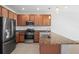 Modern kitchen with stainless steel appliances and granite counters at 4906 Avila Lakes Dr, Wimauma, FL 33598