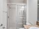 Bright bathroom with a walk-in shower and tile flooring at 4906 Avila Lakes Dr, Wimauma, FL 33598