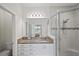 Bathroom with granite countertop and walk-in shower at 4906 Avila Lakes Dr, Wimauma, FL 33598