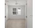 Empty bedroom featuring tile floors and a ceiling fan at 4906 Avila Lakes Dr, Wimauma, FL 33598