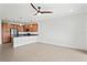 Open concept kitchen with island and stainless steel appliances at 4906 Avila Lakes Dr, Wimauma, FL 33598