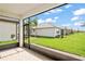 Spacious screened patio with view of the backyard at 4906 Avila Lakes Dr, Wimauma, FL 33598