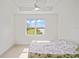 Bedroom with lake view and ceiling fan at 4906 Avila Lakes Dr, Wimauma, FL 33598