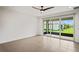 Spacious living room with sliding glass doors to backyard at 4906 Avila Lakes Dr, Wimauma, FL 33598