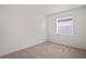 Bright bedroom with window and neutral carpet at 4906 Avila Lakes Dr, Wimauma, FL 33598