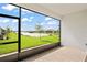 Screened patio overlooking a tranquil lake view at 4906 Avila Lakes Dr, Wimauma, FL 33598
