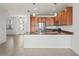 Modern kitchen with island and stainless steel appliances at 4906 Avila Lakes Dr, Wimauma, FL 33598