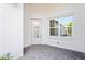 Private entryway with a tiled floor and a window at 4906 Avila Lakes Dr, Wimauma, FL 33598