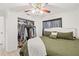 King-size bedroom with ceiling fan and large closet at 3250 Painters St, Spring Hill, FL 34606