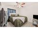 King-size bedroom with ceiling fan and built-in closet at 3250 Painters St, Spring Hill, FL 34606