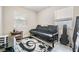 Spare bedroom with futon, natural light, and tile floors at 1611 Stevenson Dr, Clearwater, FL 33755