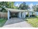 A cozy single-Gathering home with a carport and well-maintained landscaping at 1611 Stevenson Dr, Clearwater, FL 33755