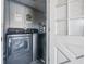 Convenient laundry room with a washer and dryer units at 1611 Stevenson Dr, Clearwater, FL 33755