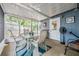 Relaxing screened porch with outdoor seating and views of the backyard at 1611 Stevenson Dr, Clearwater, FL 33755
