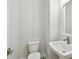 Powder room with pedestal sink and toilet at 6605 N Nebraska Ave # 27, Tampa, FL 33604