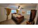 Comfortable bedroom with a ceiling fan, neutral colors, and ample natural light at 8013 N Ola Ave, Tampa, FL 33604