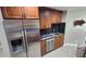 Updated kitchen featuring stainless steel refrigerator, dishwasher, and sleek countertops at 8013 N Ola Ave, Tampa, FL 33604