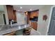 Contemporary kitchen with bar seating, stainless steel appliances, and stylish cabinetry at 8013 N Ola Ave, Tampa, FL 33604
